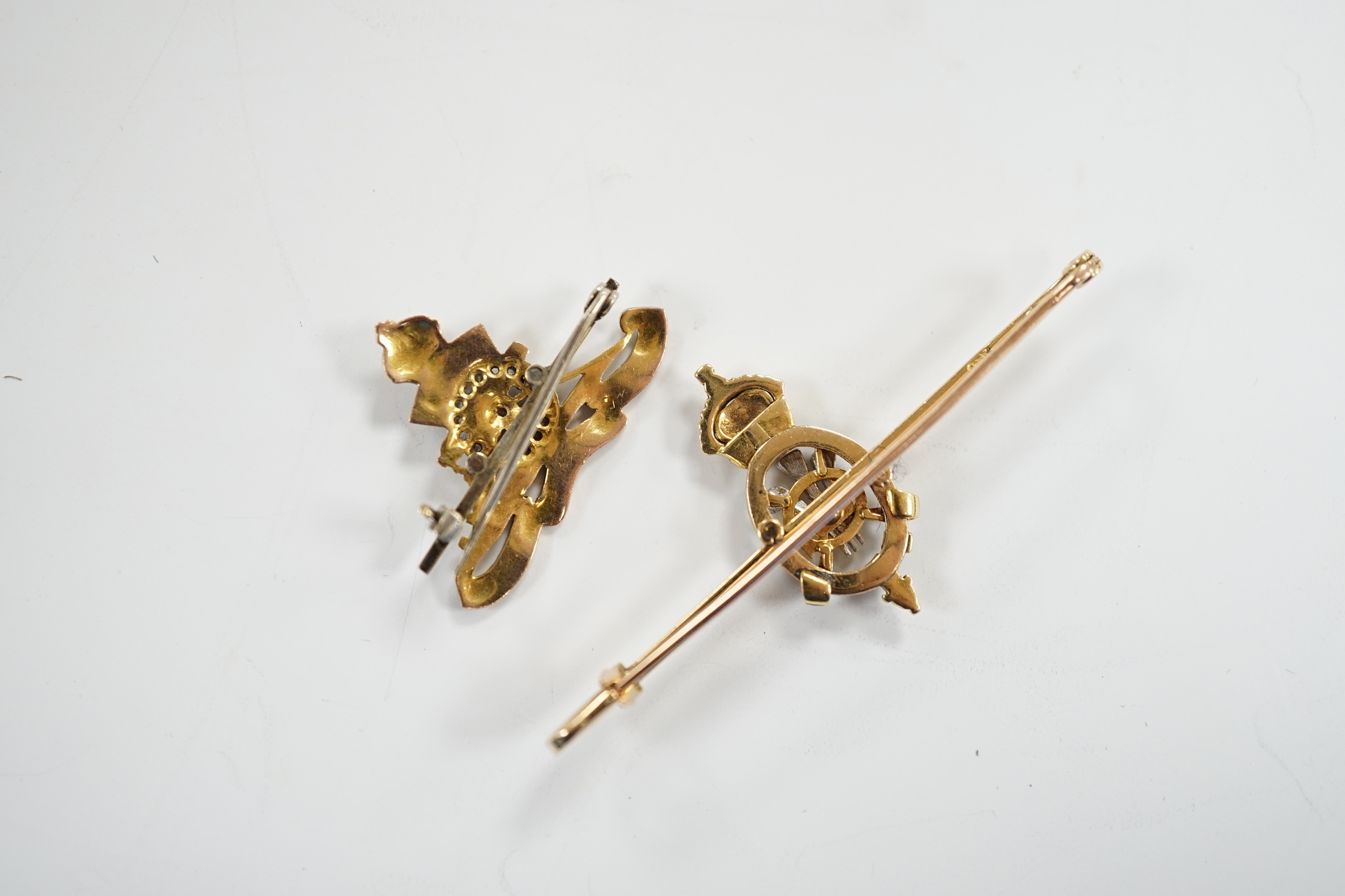 An Edwardian 15ct, enamel and rose cut diamond set Prince of Wales Order of The Garter insignia sweethearts bar brooch, 59mm and a similar yellow metal enamel and diamond chip set Royal Artillery sweethearts brooch, gros